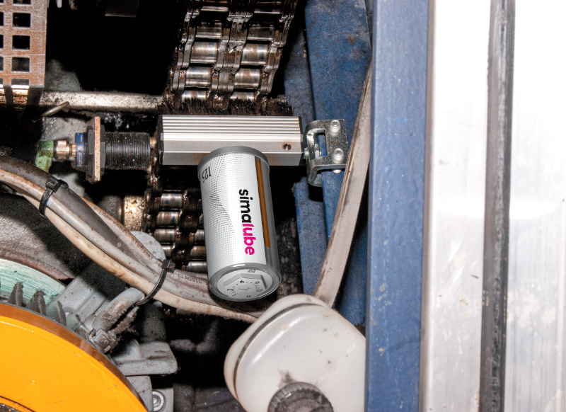 El lubricador simalube suministra aceite de forma continua a la cadena de transmisión de una escalera mecánica; el cepillo se fija directamente al perfil en U y está disponible para muchos fabricantes de escaleras mecánicas.