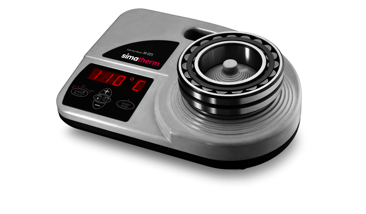 The portable simatherm IH 025 induction heater heats a medium deep groove ball bearing. The target temperature is set to 110 °C. 